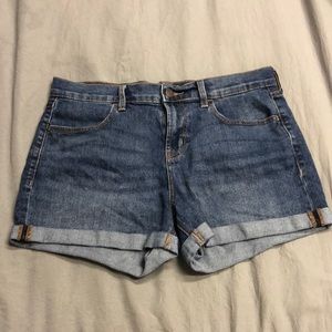 Dark denim shorts. Made in Cambodia. 78% cotton, 20% polyester, and 1% elastane